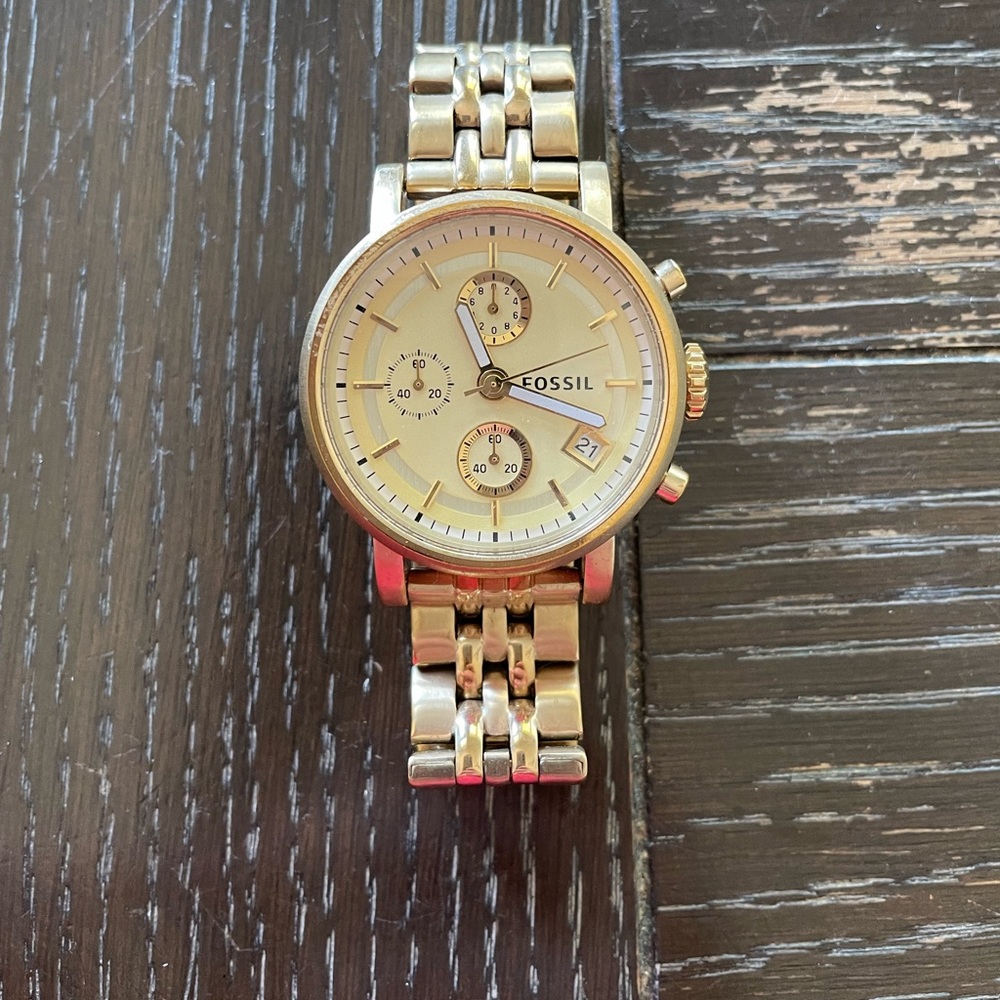 Woman’s gold Fossil watch
